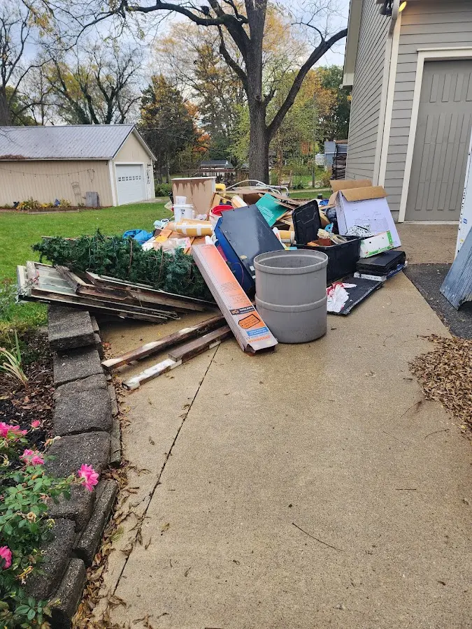 Dumpster being loaded with debris for 10 Yard Dumpster Rental in Lewiston